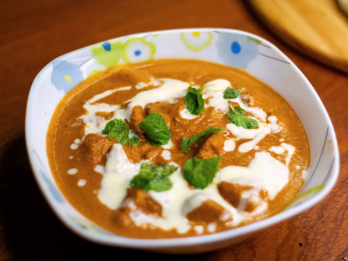 Butter chicken curry in a white dish